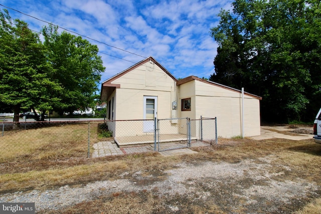 515 Burton Ave, Cambridge, MD 21613 - view of front facade featuring a gate and concrete block siding