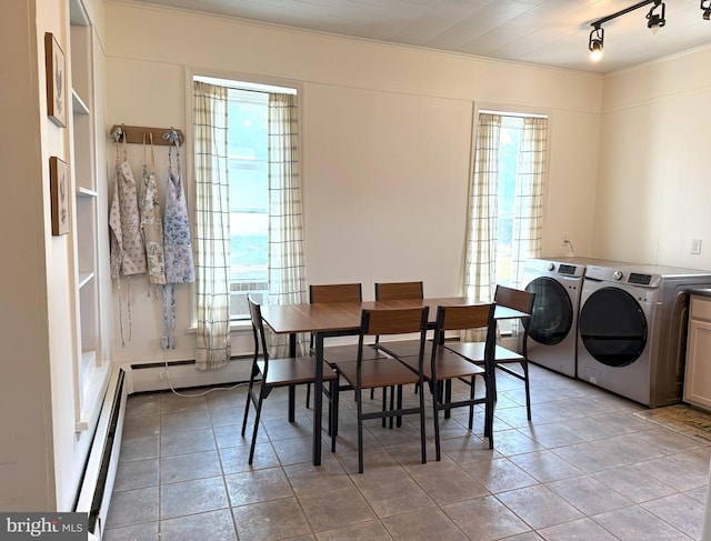 726 E Main St, Lock Haven, PA 17745 - dining space with washing machine and dryer, baseboard heating, plenty of natural light, ornamental molding, and track lighting