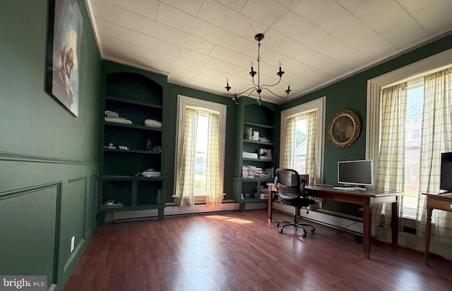 726 E Main St, Lock Haven, PA 17745 - home office featuring built in features, dark wood-type flooring, ornamental molding, and a chandelier