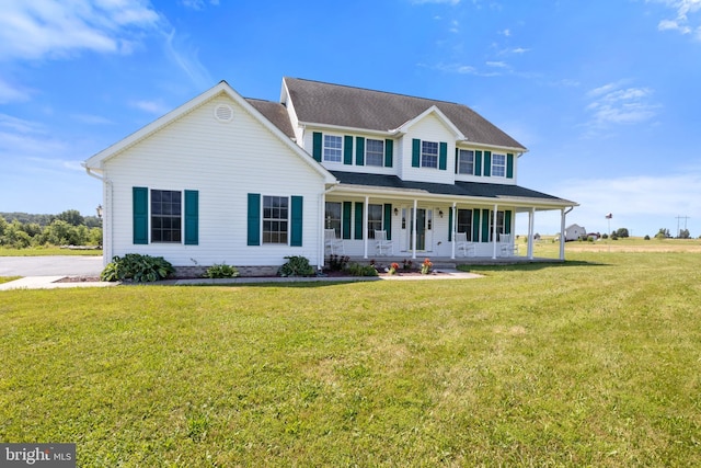 90 Hummingbird Ln, Littlestown, PA 17340 - colonial-style house featuring a porch and a front lawn
