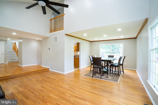 11 Adams Ct, Plainsboro, NJ 08536 - dining space featuring light wood-style floors, stairway, baseboards, crown molding, and a ceiling fan