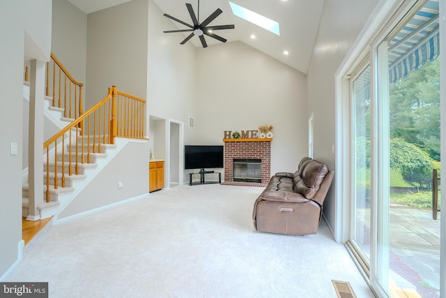 11 Adams Ct, Plainsboro, NJ 08536 - living room featuring carpet floors, high vaulted ceiling, a skylight, stairs, and plenty of natural light