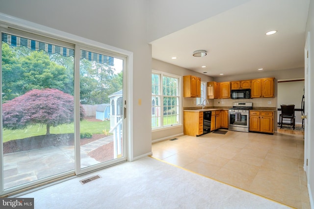 11 Adams Ct, Plainsboro, NJ 08536 - kitchen featuring black appliances, baseboards, recessed lighting, light tile patterned flooring, and brown cabinets