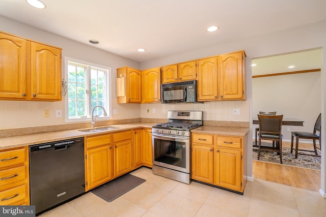 11 Adams Ct, Plainsboro, NJ 08536 - kitchen featuring black appliances, a sink, decorative backsplash, light countertops, and recessed lighting