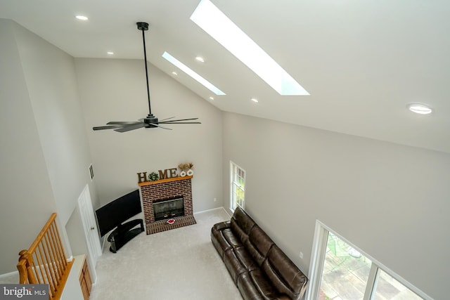 11 Adams Ct, Plainsboro, NJ 08536 - living area with high vaulted ceiling, recessed lighting, light colored carpet, a fireplace, and a skylight