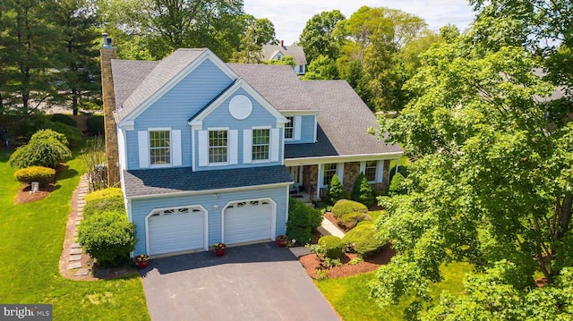 11 Adams Ct, Plainsboro, NJ 08536 - view of front of property featuring driveway, a garage, a chimney, a front yard, and roof with shingles