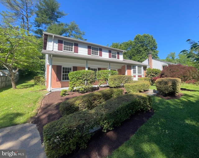 11706 Milbern Dr, Rockville, MD 20854 - view of front of house with a front lawn and brick siding