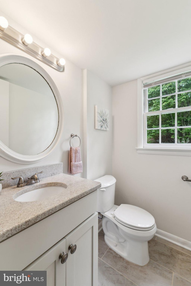 11706 Milbern Dr, Rockville, MD 20854 - half bath featuring vanity, toilet, and baseboards