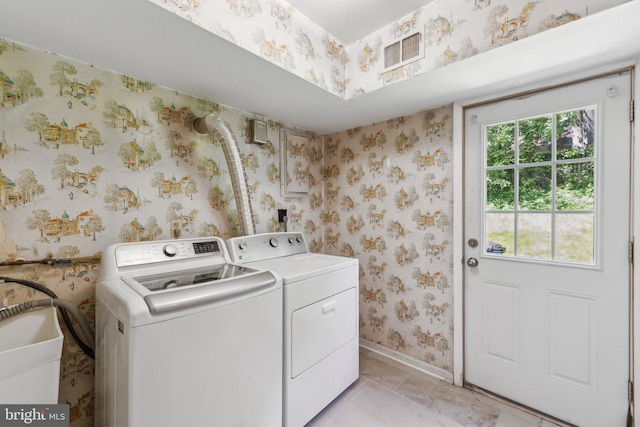11706 Milbern Dr, Rockville, MD 20854 - washroom with washer and dryer, wallpapered walls, and baseboards