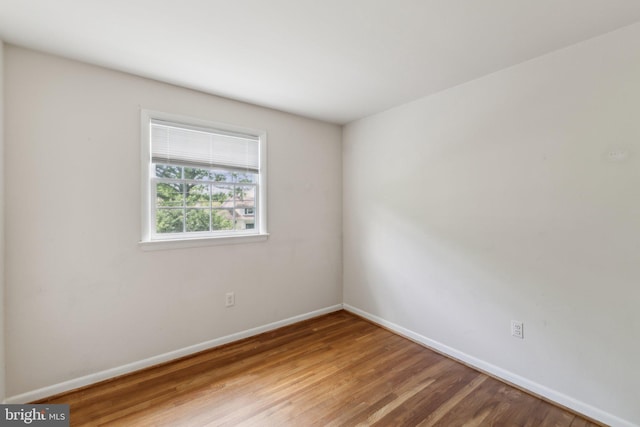 11706 Milbern Dr, Rockville, MD 20854 - spare room featuring baseboards and wood finished floors