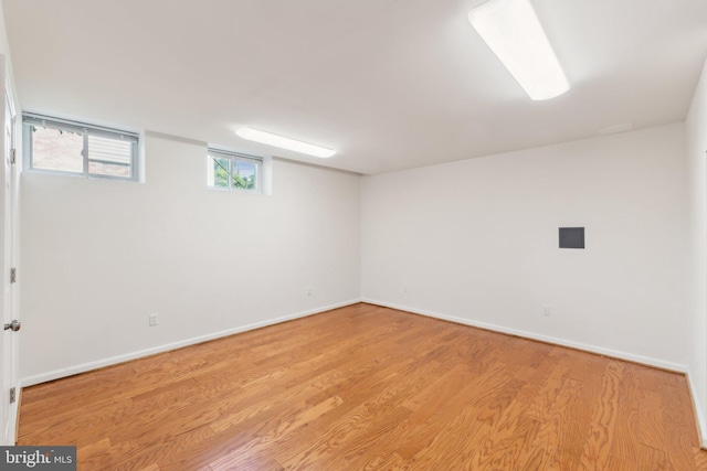 11706 Milbern Dr, Rockville, MD 20854 - basement with light wood-style floors and baseboards
