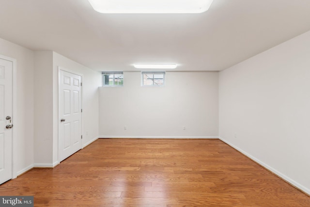 11706 Milbern Dr, Rockville, MD 20854 - basement with light wood-style floors and baseboards