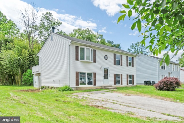 7102 Walnut Ave, Baltimore, MD 21208 - view of front of house with a front lawn