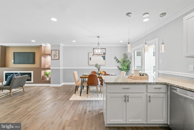 7102 Walnut Ave, Baltimore, MD 21208 - kitchen with stainless steel dishwasher, recessed lighting, crown molding, light wood-style flooring, and light stone countertops