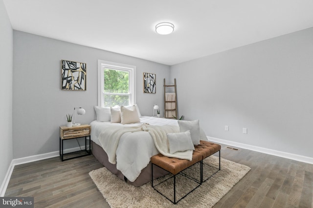 7102 Walnut Ave, Baltimore, MD 21208 - bedroom featuring baseboards and wood finished floors