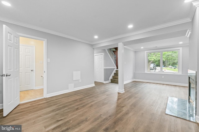 7102 Walnut Ave, Baltimore, MD 21208 - unfurnished living room with stairs, baseboards, recessed lighting, wood finished floors, and ornamental molding