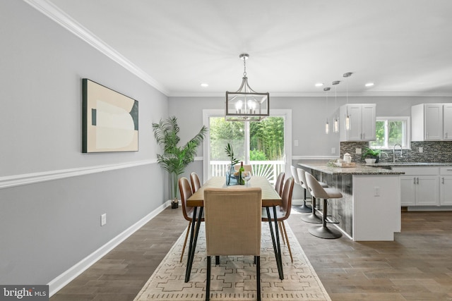 7102 Walnut Ave, Baltimore, MD 21208 - dining room featuring recessed lighting, a chandelier, wood finished floors, baseboards, and ornamental molding