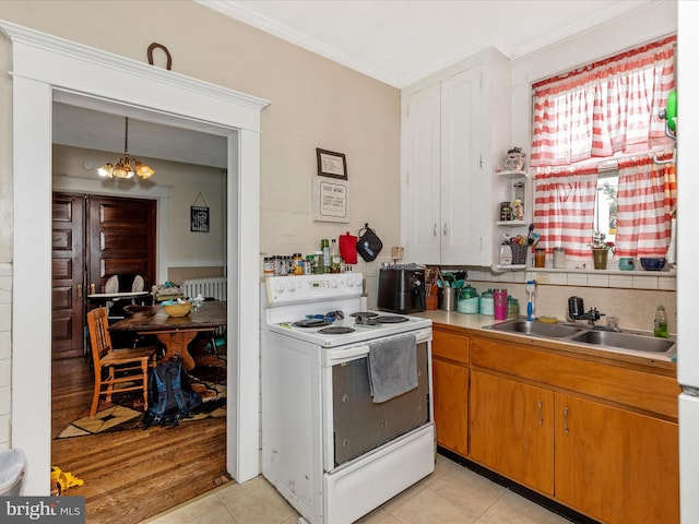 250 E E Main St, Waynesboro, PA 17268 - kitchen with electric range, a chandelier, crown molding, a sink, and radiator heating unit
