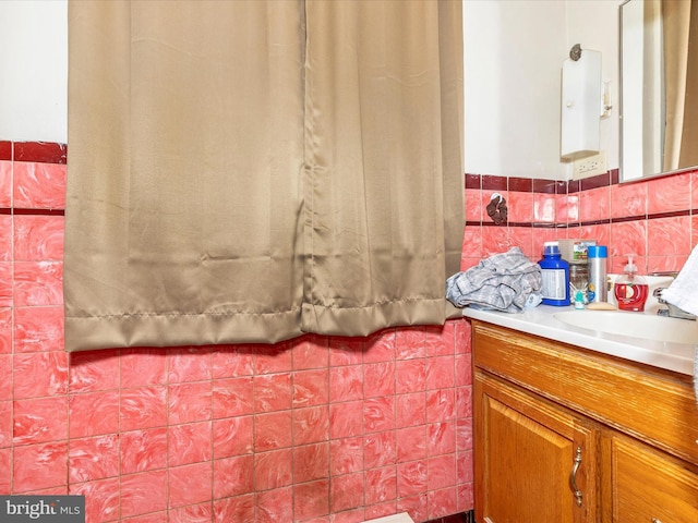 250 E E Main St, Waynesboro, PA 17268 - bathroom with vanity, tile walls, and wainscoting