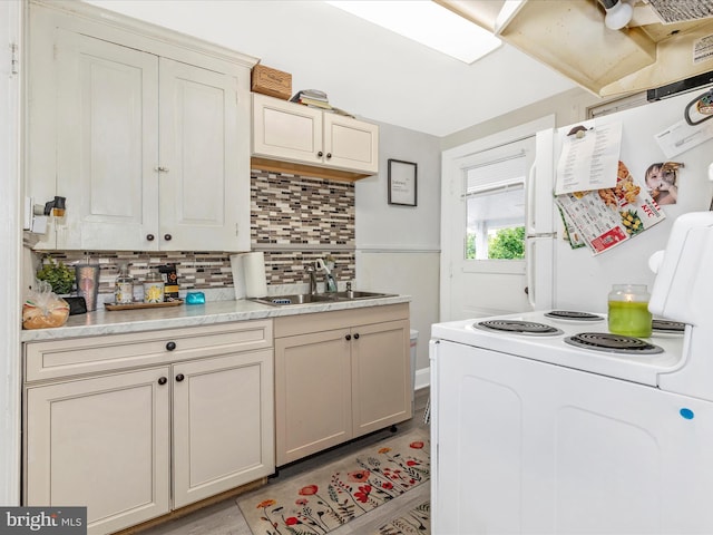 250 E E Main St, Waynesboro, PA 17268 - kitchen featuring light countertops, a sink, backsplash, electric stove, and light wood-type flooring