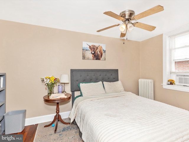 250 E E Main St, Waynesboro, PA 17268 - bedroom featuring radiator, baseboards, wood finished floors, and a ceiling fan