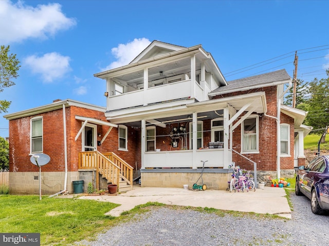 250 E E Main St, Waynesboro, PA 17268 - view of front of property with a balcony, brick siding, and a porch