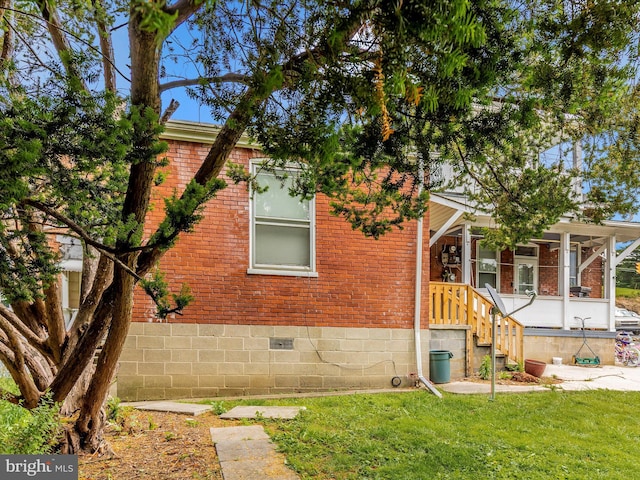 250 E E Main St, Waynesboro, PA 17268 - view of side of home with brick siding, a yard, and crawl space