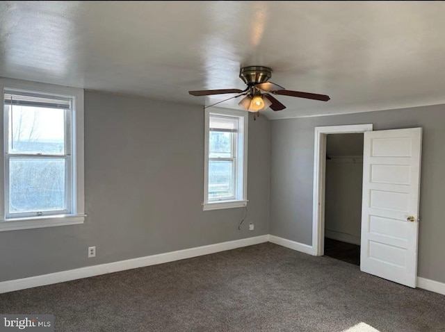 250 E E Main St, Waynesboro, PA 17268 - unfurnished bedroom featuring dark colored carpet, baseboards, a closet, and a ceiling fan