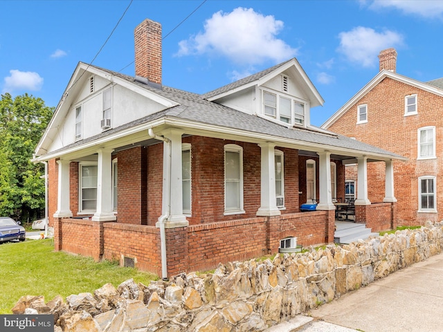 250 E E Main St, Waynesboro, PA 17268 - view of front of house featuring covered porch, brick siding, a chimney, and a shingled roof