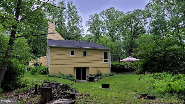212 Haag Rd, Reading, PA 19606 - rear view of property featuring a yard and a chimney