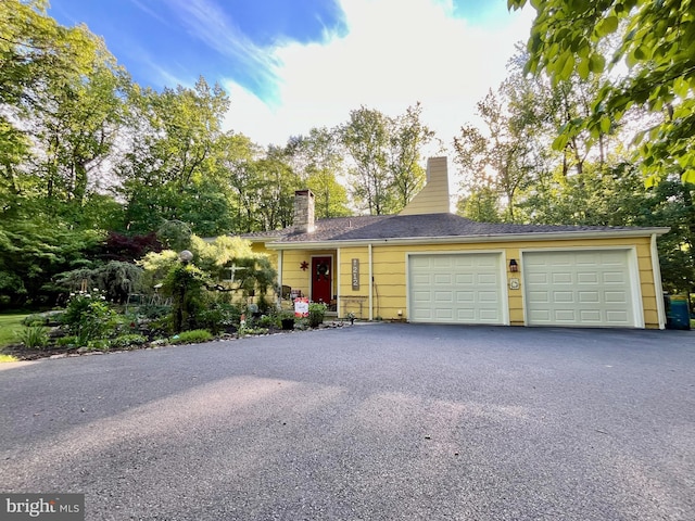 212 Haag Rd, Reading, PA 19606 - view of front of property with a chimney, driveway, and a garage