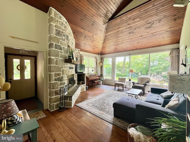 212 Haag Rd, Reading, PA 19606 - living area featuring high vaulted ceiling, wooden ceiling, a stone fireplace, and wood-type flooring