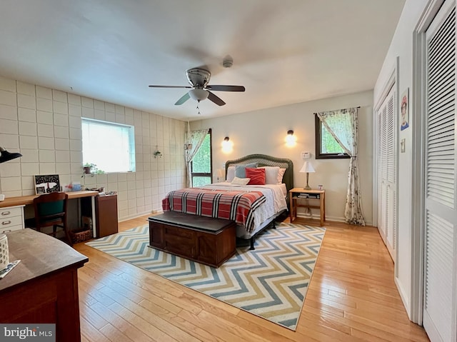 212 Haag Rd, Reading, PA 19606 - bedroom featuring light wood finished floors, multiple windows, tile walls, and a ceiling fan