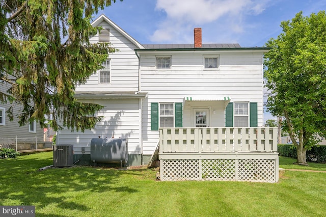 101 N Mildred St, Ranson, WV 25438 - back of property featuring heating fuel, central air condition unit, a wooden deck, a chimney, and a yard