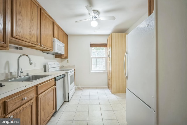 8361 Luce Ct, Springfield, VA 22153 - kitchen with white appliances, ceiling fan, light countertops, brown cabinetry, and light tile patterned floors