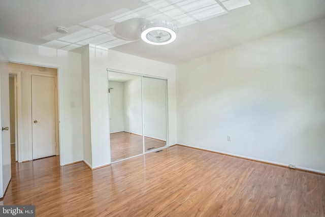 8361 Luce Ct, Springfield, VA 22153 - unfurnished bedroom featuring wood finished floors and a closet