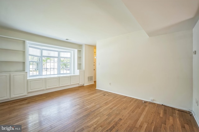 8361 Luce Ct, Springfield, VA 22153 - unfurnished room with built in shelves and light wood finished floors