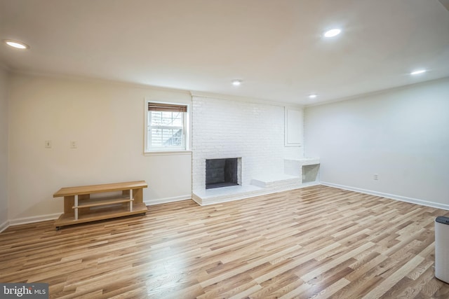 8361 Luce Ct, Springfield, VA 22153 - unfurnished living room featuring a brick fireplace, wood finished floors, and recessed lighting