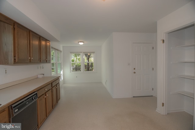 9 Paddington Ct, Hockessin, DE 19707 - kitchen featuring dishwasher, brown cabinets, light carpet, and light countertops