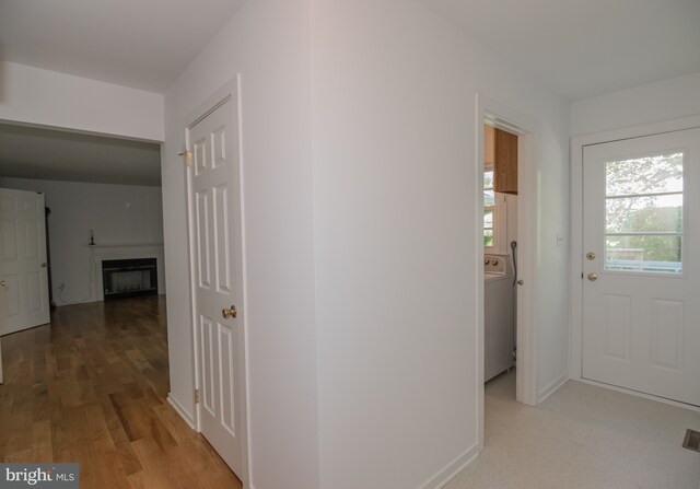 9 Paddington Ct, Hockessin, DE 19707 - hall with washer / dryer and light wood-type flooring