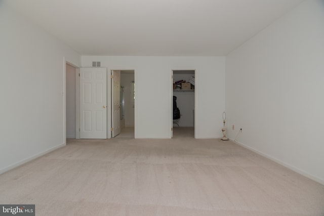 9 Paddington Ct, Hockessin, DE 19707 - unfurnished bedroom featuring carpet floors, a walk in closet, baseboards, and a closet