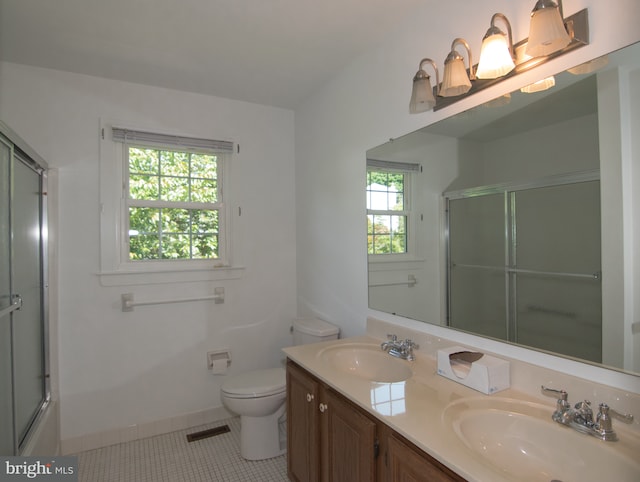 9 Paddington Ct, Hockessin, DE 19707 - full bath featuring a shower with door, tile patterned floors, toilet, double vanity, and baseboards