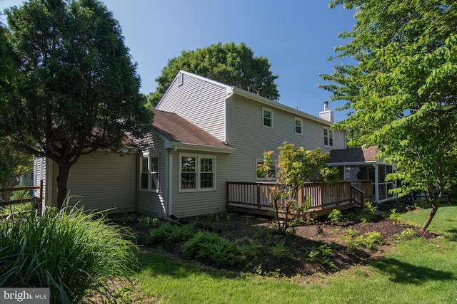 9 Paddington Ct, Hockessin, DE 19707 - rear view of property featuring a deck, a chimney, and a lawn