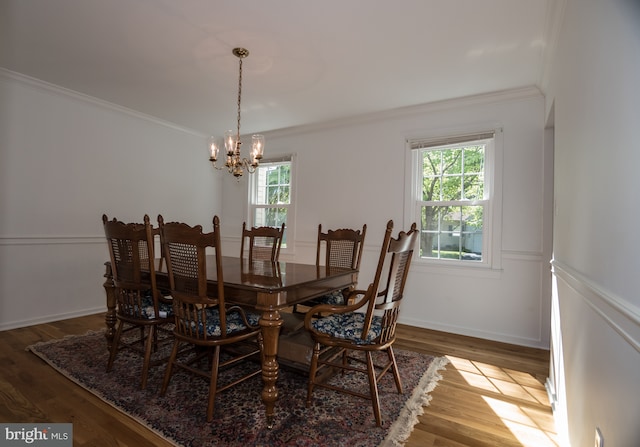 9 Paddington Ct, Hockessin, DE 19707 - dining room with a chandelier, ornamental molding, and wood finished floors