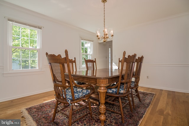9 Paddington Ct, Hockessin, DE 19707 - dining area with a chandelier, crown molding, wood finished floors, and baseboards