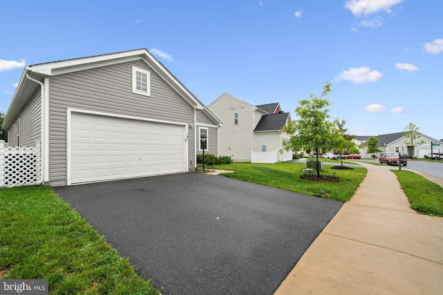 141 Patchwork Dr, Stephenson, VA 22656 - view of front facade with asphalt driveway, a garage, and a front yard