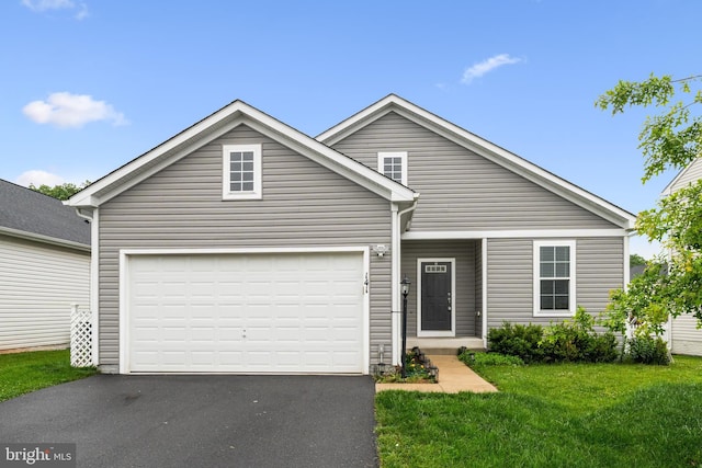 141 Patchwork Dr, Stephenson, VA 22656 - traditional home featuring asphalt driveway, a front yard, and an attached garage