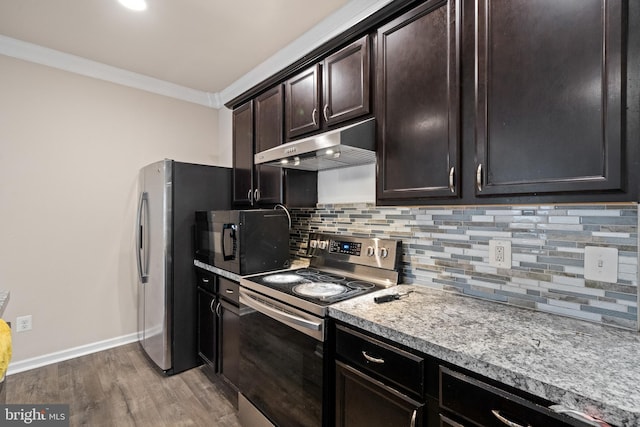 141 Patchwork Dr, Stephenson, VA 22656 - kitchen with stainless steel appliances, under cabinet range hood, decorative backsplash, light wood-type flooring, and light countertops