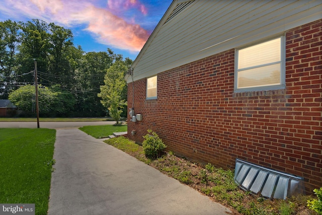 7434 Dickenson St, Springfield, VA 22150 - property exterior at dusk with brick siding and a yard