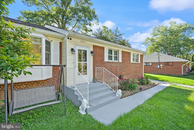 7434 Dickenson St, Springfield, VA 22150 - view of front of house with a front yard and brick siding